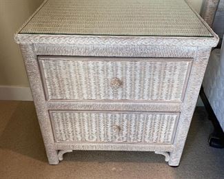 One of two matching two-drawer wicker nightstands by Lexington (Henry Link).