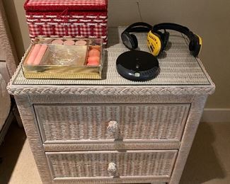 One of two matching two-drawer wicker nightstands by Lexington (Henry Link).