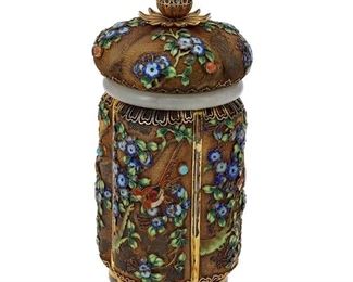1003
A Chinese Gilt-Silver And Cloisonné Jar
First-Quarter 20th Century
Marked: Silver
The lobbed, gilt-silver lidded jar with cloissonné enamel floral motifs on a metal mesh ground and finished with a nephrite collar
7" H x 3.5" Dia.
Estimate: $1,000 - $1,500