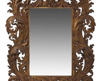 1034
A Carved Giltwood Wall Mirror
Late 19th/Early 20th Century
The giltwood wall mirror with openwork carved scrolling acanthus leaves surrounding a rectangular mirror
58" H x 47.5" W x 1.5" D
Estimate: $1,500 - $2,500