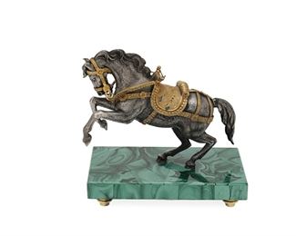 1041
A Viennese Parcel-Gilt Horse
20th Century
Appears unmarked
The parcel-gilt, silvered metal horse raised on a malachite base with brass feet
5.25" H x 5" W x 2.75" D
Estimate: $300 - $500