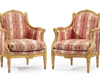 1046
A Pair Of Louis XVI-Style Carved Giltwood Armchairs
First-Quarter 20th Century
Each armchair with carved giltwood frame with curved crest rail, pointed finials, and acanthus leaf and rosette motifs atop pink floral silk upholstery and elbow pads, raised overall on four tapered fluted legs, 2 pieces
Each: 37" H x 28" W x 23" D
Estimate: $1,500 - $2,500