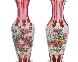1059
A Pair Of Bohemian Art Glass Vases
Fourth-Quarter 19th Century
Each baluster-form vase acid-cut from opaque white to translucent cranberry glass centering polychrome floral sprays with gilt highlights, 2 pieces
Each: 17" H x 6.375" Dia.
Estimate: $1,500 - $2,500