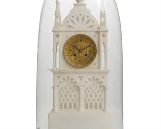 1067
A French Carved Alabaster Mantel Clock
Mid-19th Century
Movement marked: 155 D
The clock with a gilt-brass dial with black Roman numeral hour markers, outer minute track, and an 8-day two train key wind movement with silk suspension set in a carved alabaster case in the form of a Gothic cathedral with half rose window, column-lined triforium, openwork carved pointed arches with tracery, and quatrefoils, raised overall on a black lacquered wood stand with glass dome
21.75" H x 8.75" W x 4.5" D
Estimate: $1,500 - $2,500