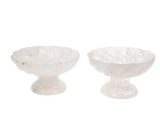 1068
A Pair Of Rock Crystal Compotes
20th Century
Each rock crystal compote with a spiral scalloped design, 2 pieces
Each: 5.125" H x 9.125" Dia.
Estimate: $1,000 - $1,500