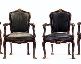 1070
A Set Of French Armchairs
19th Century
Each chair with a carved wood carcass, gilt-bronze mounts, and modern faux-leather upholstery, issuing a squared upholstered backrest surmounted by a rocaille crest, flanked by two channeled scrolled arms with elbow pads, and a stuffed seat, finished with nail head trim, raised on four cabriole legs with paw feet, 4 pieces
Each: 39" H x 25.75" W x 23" D
Estimate: $4,000 - $6,000