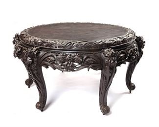 1080
A Japanese Carved Wood Table
Meiji Period (1868-1912)
Signed in Japanese within a cherry blossom cartouche
Ebonized wood, the circular top over an apron carved in high relief with blooming irises over six conformingly carved cabriole legs raised on casters
34.75" H x 70.25" Dia.
Estimate: $1,500 - $2,500