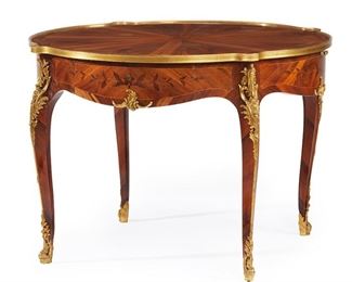 1088
A French Victor Raulin Louis XV-Style Parlor Table
Fourth-Quarter 19th Century
Signed to plaque inside drawer
The parquetry veneered parlor table with circular top over an apron with floral marquetry, two frieze drawers, and two extendable surfaces with gold foil-stamped leather raised on four cabriole legs with sabots to the feet
28.25" H x 41.25" Dia.
Estimate: $7,000 - $9,000