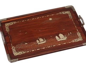 1095
A Chinese Wood Tray With Silver Inlay
Late 19th/Early 20th Century
Indistinctly marked
The rectangular wood tray with silver inlay and handles centering a coastal landscape scene with boats and birds
3.5" H x 29.25" W x 18.75" D
Estimate: $800 - $1,200