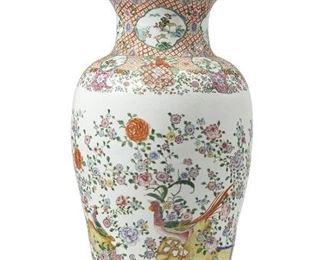 1099
A Large Chinese Famille Rose-Style Porcelain Urn
20th Century
The large, baluster-form lidded urn with polychrome floral sprays and birds surrounded by geometric and floral borders centering small reserves of architectural landscape scenes, surmounted by a guardian lion finial
45" H x 16" Dia.
Estimate: $1,000 - $1,500