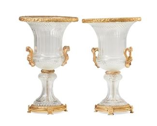 1107
A Pair Of Large Baccarat-Style Crystal Urns
First-Quarter 20th Century
One bears mark for Baccarat
Each cut crystal, krater-form urn mounted with gilt-bronze leaf borders and opposed figural mask handles, raised on a footed support with bead trim, 2 pieces
Each: 24.5" H x 15.5" Dia.
Estimate: $2,500 - $3,500