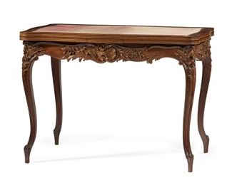 1153
A French Louis XV-Style Refectory Game Table
Circa 1920s-1930s
The carved wood table with an extendable rectangular top with inset velvet surface over a rocaille-motif carved apron with gilt highlights raised on four cabriole legs
28.5" H x 39.5" W x 24.125" D; Extended: 67.25" W
Estimate: $800 - $1,200