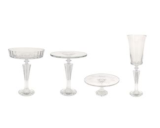 1164
A Group Of Baccarat "Mille Nuits" Crystal Items
20th Century
Each etched: Baccarat / France
Comprising a large flower vase (23.25" H x 7.25" Dia.), a large pedestal fruit bowl (15" H x 11.375" Dia.), a large cake stand (13.375" H x 11.25" Dia.), and a small cake stand (5.375" H x 11.375" Dia.), 4 pieces
Estimate: $800 - $1,200