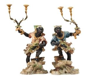 1166
A Pair Of Carved Wood Figural Candelabra
19th Century
Each carved and polychromed giltwood in the form of a figure in traditional costume holding aloft two foliate-style arms with floral capitals, 2 pieces
Each: 33" H x 14" W x 15" D approximately
Estimate: $1,500 - $2,000