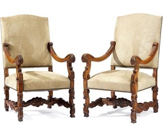 1185
A Pair Of Italian Carved Wood Armchairs
Late 19th/Early 20th Century
Each chair with beige suede upholstered back and stuffed seat on a carved wood frame, finished with nail head trim, flanked by scrolled arms and raised on four legs joined by an H-stretcher, 2 pieces
Each: 43.75" H x 26" W x 28" D
Estimate: $1,000 - $1,500