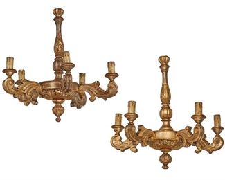 1186
A Pair Of Italian Carved Giltwood Chandeliers
First-Quarter 20th Century
Each carved giltwood chandelier with knopped column issuing five scrolled arms terminating in faux candle sleeves with all-over scrolling foliate motifs, electrified, 2 pieces
Each: 28" H x 26" Dia. approximately
Estimate: $700 - $900