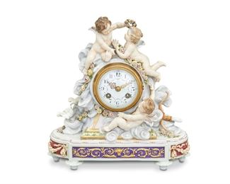 1198
A Japy Frères Figural Porcelain Mantle Clock
Second-Half 19th Century
Movement signed: Japy Freres et Cie / Med. D'Honnuer / 57452; Porcelain signed: E. Jammes; marked indistinctly to underside and numbered: 1627
The clock with a white painted metal dial, black Arabic numeral hour markers and outer minute track, polychrome floral festoons, gilt hands, and two train movement set in a gilt-bronze bezel with bead trim enclosed in a figural porcelain case with three putti atop stylized clouds surrounded by flowers and doves, atop an oblong base with relief floral festoons and gilt scrolling foliage raised overall on four toupie feet
12.25" H x 12" W x 5.5" D; Dial: 3.125" Dia.
Estimate: $1,000 - $1,500