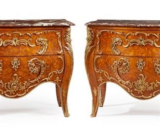 1200
A Pair Of French Louis XV-Style Marquetry Commodes
Late 19th/Early 20th Century
Each with a brown marble top over two long drawers with floral marquetry veneer and gilt-bronze mounts raised on slightly outswept legs with sabots to the feet, 2 pieces
Each: 35.25" H x 48.5" W x 20.5" D
Estimate: $5,000 - $7,000