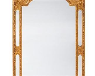 1204
A Carved Giltwood Wall Mirror
19th Century
The carved giltwood frame with a hat and musical instrument crest against a spray of oak leaves over a conformingly designed frame with an arched rectangular mirror surrounded by inset mirror panels
62.5" H x 34.5" W x 4.5" D
Estimate: $1,200 - $1,800