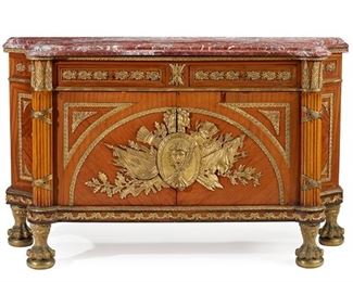 1211
A French Louis XVI-Style Parquetry Buffet
20th Century
The marble top over two long drawers and a two-door cabinet flanked by two reeded columns, with all-over gilt-bronze mounts and centering a figural mask with crossed torches and flags, raised on four ball-and-claw feet
39" H x 63.5" W x 21.5" D
Estimate: $1,500 - $2,500
