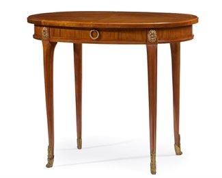 1218
A French Satin Wood Table
Late 19th/Early 20th Century
The table with an oval top with book-match parquetry over an apron with a single frieze drawer and gilt-bronze mounts, raised on four legs with sabots to the feet
29.875" H x 35.25" W x 23.25" D
Estimate: $500 - $700