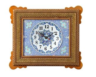 1223
A Persian Isfahani Wall Clock
20th Century
The clock with an inset painted metal dial with black Arabic numeral hour markers surrounded by blue arabesque motifs and enclosed in a glazed wood frame with gilt highlights
15.5" H x 18" W x 2.375" D
Estimate: $800 - $1,200