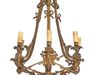 1232
A French Gilt-Bronze Chandelier
19th Century
The gilt-bronze chandelier with all-over floral and foliate motifs issuing six arms with laurel swags and bow ribbons, terminating in a faux candle sleeve light socket atop figural masks, electrified
38" H x 23" Dia. approximately
Estimate: $800 - $1,200