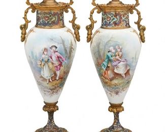 1231
A Pair Of French Sèvres-Style Porcelain And Champlevé Urns
19th Century
Each porcelain signed: Luigi
Each brass mounted baluster-form urn with lid and polychrome champleve enamel neck atop a tapered painted porcelain body decorated with pastoral courting scenes and gilt highlights mounted with two scrolled foliate handles over a flared polychrome champleve enamel column with laurel leaf border raised on an octagonal foot, 2 pieces
Each: 11.5" H x 4" W x 3.5" D
Estimate: $1,500 - $2,000