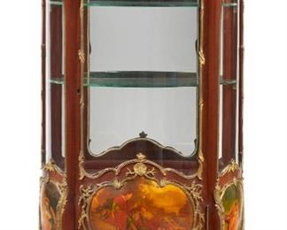 1234
A French Vernis Martin-Style Vitrine Cabinet
19th Century
The Louis XV-style gilt bronze-mounted vitrine with a single-door glazed cabinet with mirrored interior and two glass shelves atop three vernis Martin-style painted pastoral figural scenes raised on four splayed feet with sabots
62.25" H x 32.75" W x 17" D
Estimate: $7,000 - $9,000