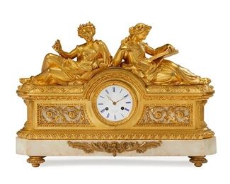 1237
A French Gilt-Bronze And Marble Mantel Clock
Late 19th/Early 20th Century
Dial marked: V.or Paillard [Victor Paillard] / Fab.t. de Bronze / Paris; Movement marked: Vincenti et Cie / Medaille d'Argent / Rodier a Paris / B66 / 194 / 313
The clock with an enameled metal dial with blue Roman numeral hour markers, outer minute track, and two train movement set in a gilt-bronze and white marble case surmounted by two recumbent female figures, possibly the muses Urania and Calliope, raised on four toupie feet
18" H x 25.5" W x 6.25" D
Estimate: $6,000 - $8,000