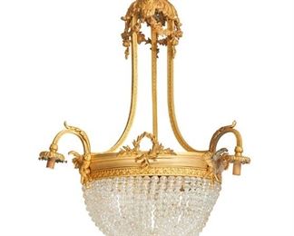 1249
A French Gilt-Bronze Chandelier
First-Quarter 20th Century
The six-light, gilt-bronze chandelier with acanthus leaves and floral festoons issuing three out-swept arms, each terminating in a drop pendant light, surrounding a central basin with glass bead chains containing three interior lights and decorated with laurel wreaths and crossed torches, electrified
33" H x 22" Dia. approximately
Estimate: $3,000 - $5,000