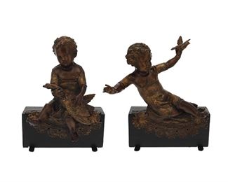 1251
A Pair Of Patinated Metal Putti Figures
19th Century
Each patinated metal putto holding a bird and seated atop a lace-style festoon, mounted to a painted wood base, 2 pieces
Each: 16.5" H x 12" W x 7" D approximately
Estimate: $600 - $800