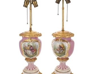 1257
A Pair Of French Sèvers-Style Porcelain Table Lamps
First-Quarter 20th Century
Each two-light, baluster-form porcelain lamp centering figural and floral reserves on a pink ground with gilt highlights mounted with gilt-bronze trim and raised on an openwork gilt-bronze foot, electrified, 2 pieces
Each: 27" H x 8" Dia.
Estimate: $600 - $800