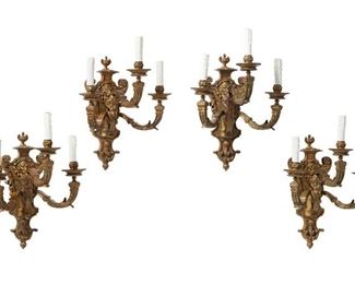 1258
A Set Of Gilt-Bronze Wall Sconces
First-Quarter 20th Century
Each gilt-bronze wall sconce with an architectural back plate designed with scrolling foliage, an urn finial, and figural masks issuing three conformingly designed arms terminating in faux candle sleeve light sockets, electrified, 4 pieces
Each: 18" H x 15" W x 11" D
Estimate: $600 - $800
