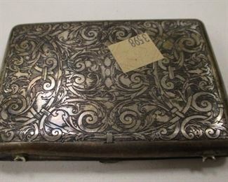 AN ANTIQUE STERLING SILVER PURSE/CARD CASE.  MONOGRAMMED 'LKG'.  3 7/8" X 2 3/4".  GROSS WEIGHT 3.51 TROY OUNCES.  BUYER'S PREMIUM EXEMPT IF AT OR OVER $58.00

AS IS CONDITION: HAS DENTS, MISSING THE HANDLE/BROKEN HOOKS