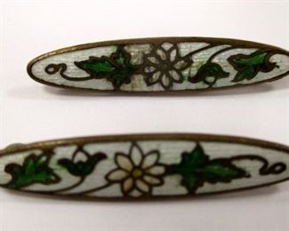 A PAIR OF DECO ENAMELED BAR PINS. MADE IN A CLOISONNE STYLE. 1.25" LONG. One has some crazing in the center