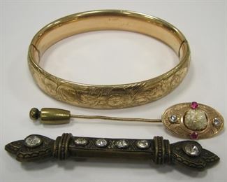 THREE ANTIQUE COSTUME JEWELRY PIECES:
A GF VICTORIAN HINGED BANGLE. SIGNED PR ST CO. CLASP WORK, BUT BRACELET IS LOOSE FROM AGE
A STICK PIN
A BRONZE TONE BAR PIN WITH RHINESTONES. 2.75" LONG. SOME REMOVABLE CORROSION ON REVERSE. (try some wd-40 and a small brush, don't wash the rhinestones or you'll ruin them)
