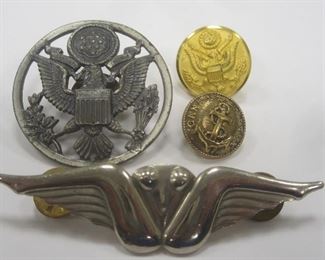 U.S. ARMY HAT EMBLEM
TWO BUTTONS
A WINGS PIN THAT COULD BE INTERPRETED DIFFERENTLY DEPENDING ON YOU PERSPECTIVE AND THE WAY YOU LOOK AT THINGS. (HINT, NOT A MALE)