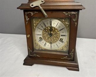Wind Up Mantel Clock
Dark wooden mantel clock with Roman numeral face. H12" x W9" x D6.5". Windup key attached. Good condition