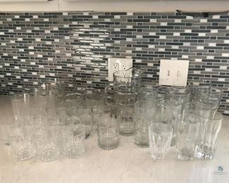 Assorted Kitchen Glasses
Multiple styles of drinking glasses and tumblers plus one pitcher. Pitcher is 9"H, drinking glasses are 5.5"H, tumblers are 3.5"H. No visible damage seen.