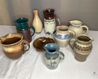 Ceramic Pitchers and more
Nine (9) pieces total. Eight (8) Ceramic Pitchers, one (1) serving dish. Some of these items are hand crafted. Two Pitchers have chips on rims. Tallest one measures 10"H. Some are signed by the artist on the bottom.