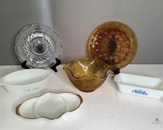 Vintage and Depression Ware
One Indiana Tiara Amber glass egg platter, 12". One Indiana Tiara amber glass ruffled edged bowl, 10". One Anchor Hocking Wexford clear sectioned platter. One Fire King white with gold rimmed sectioned plate. Some of the gold has worn off in places. Two Anchor Hocking white casserole dishes with blue flower design. Round casserole dish the blue design has mostly worn off in areas. The rectangular dish has some of the design worn off. No other visible damage.
