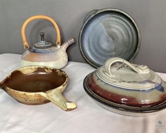 Assorted Pottery
Assorted pottery pieces: one (1) covered dish in cream/burgundy/blue tones H5" x 11" diameter, one (1) teapot tan & blue H9" x W10.5" x D8.5, one (1) frying pan two tone brown H2.5" x 8" diameter, one (1) round serving dish blue H2.5" x 10" diameter. No visible damage seen.