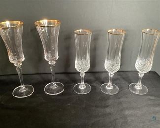 Champagne Glasses
Tall stemmed cut glass champagne glasses. All have gold colored rims. Tall ones are 9"H and the others are 8"H. No visible damage seen.