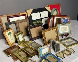 Photo Frames Galore!
Approximately thirty (3) picture frames of various shapes & sizes of wood & metal. Largest: H15" x W12" Smallest: H1" x W1.5" Most with nothing in frame, several with cat pictures in frames. One (1) four photo grouping (new in packaging), one (1) shadow box/photo combo. Good condition