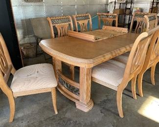 Large dining room table with one large extra leaf and 8 chairs.