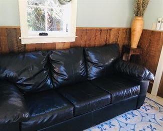 Dark brown solid leather three seater sofa