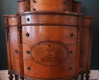 Tall demi lune tall dresser with elaborate details......