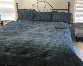King size bed with iron headed board.