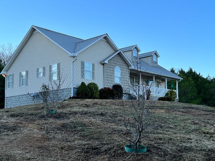 3 bedroom, 2 bath house with 2 car garage basement and barn sitting on 7 acres across the road from Smith Lake, $450,000 or best offer—